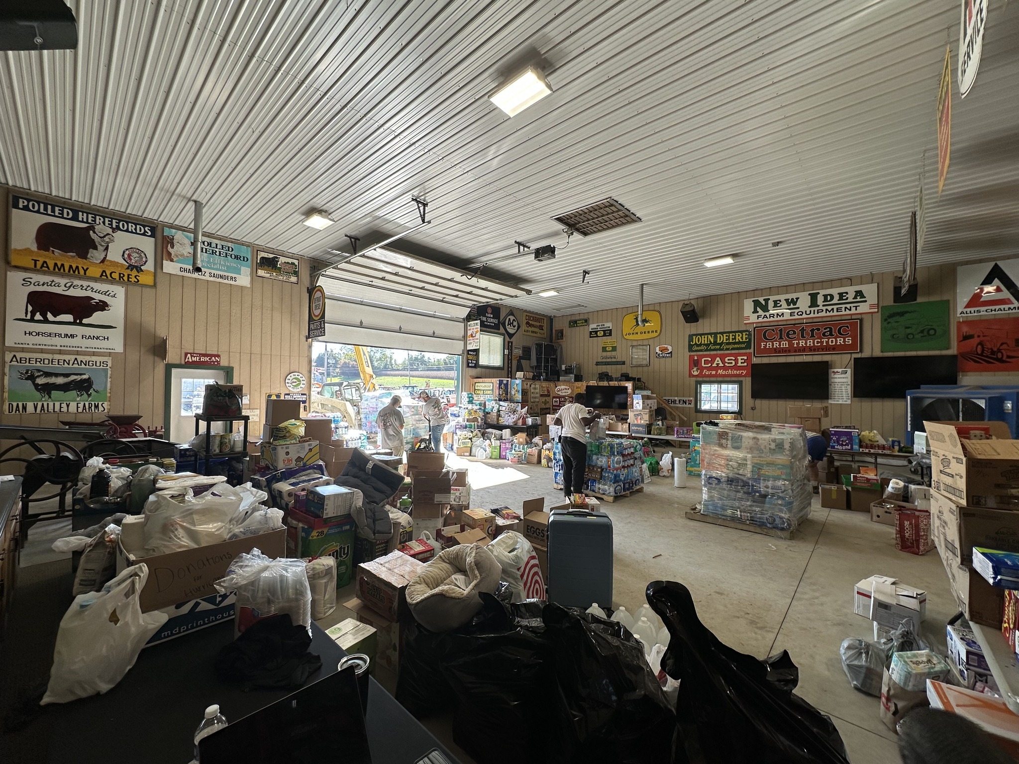 Auction warehouse filled with tools, parts, and equipment