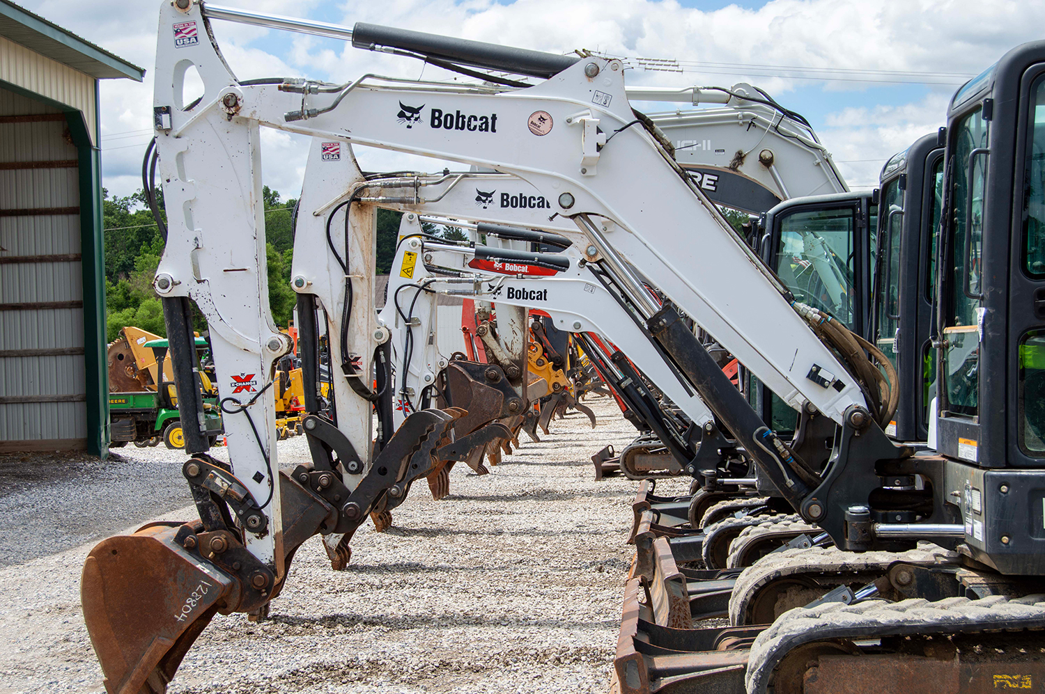 Used Bobcat Excavators Lined Up on Auction Lot