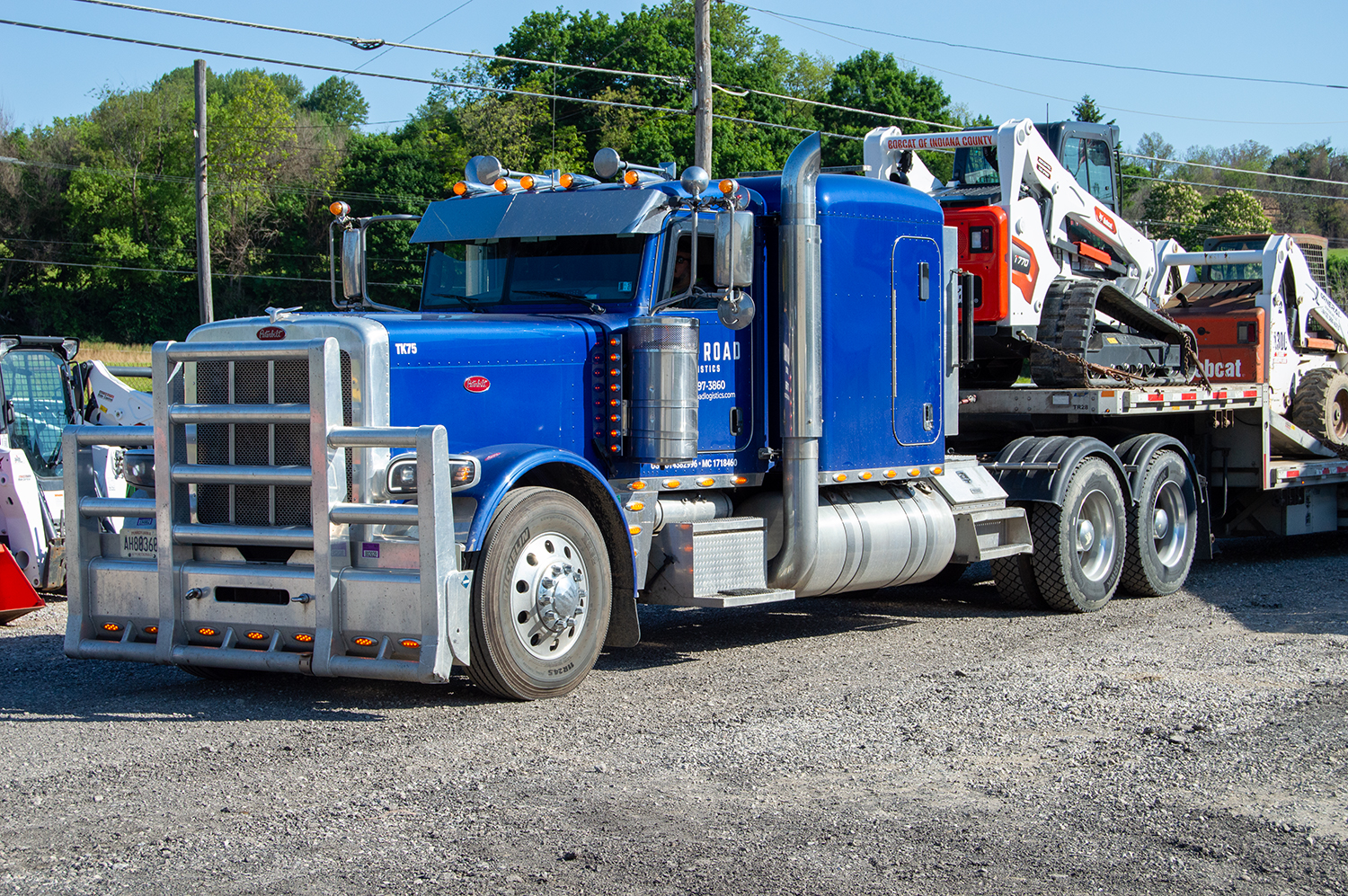 Iron Road Logistics Truck Hauling Bobcat Skid Steers