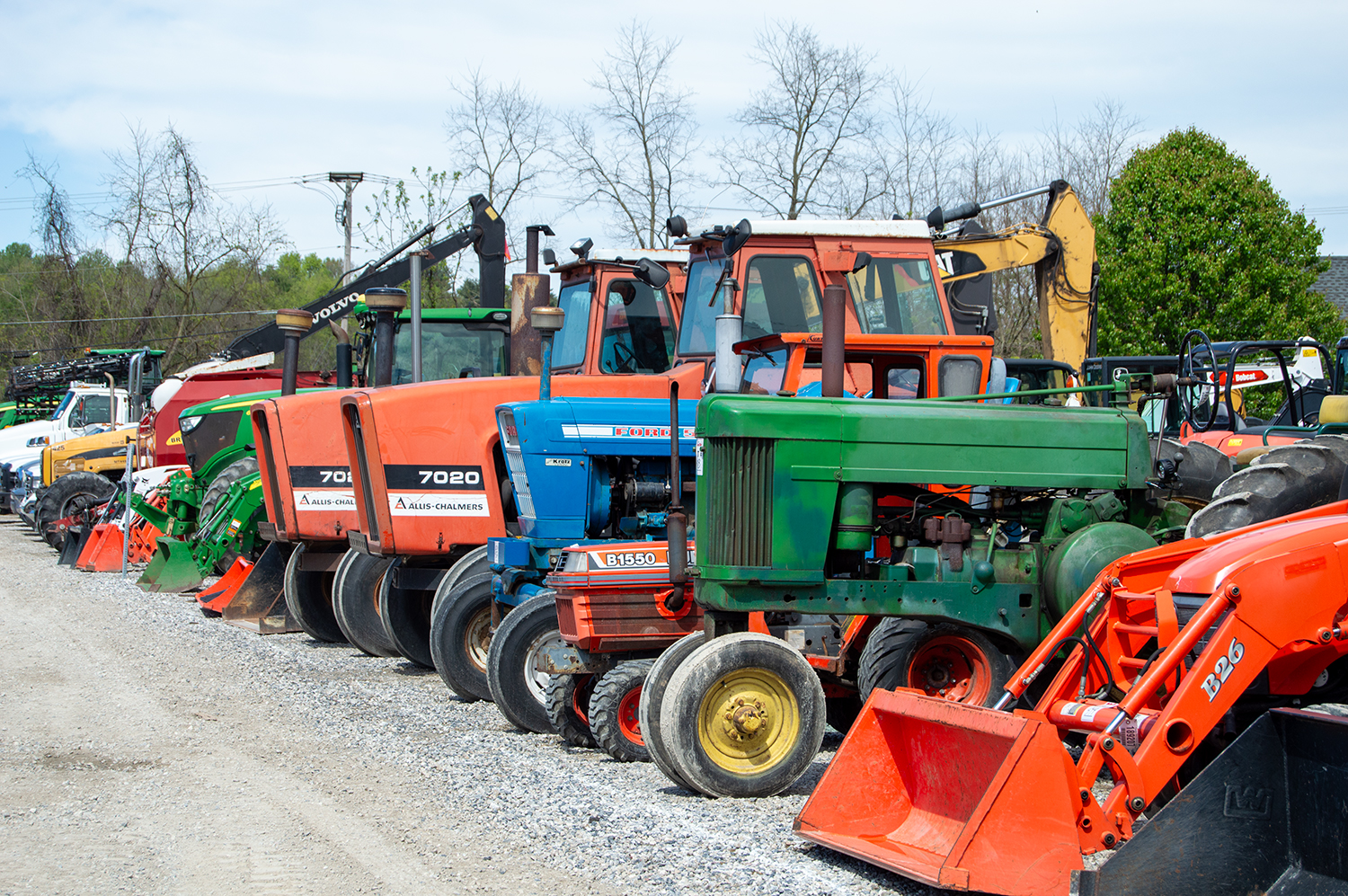 Old Used Tractors Lined Up on Auction Lot