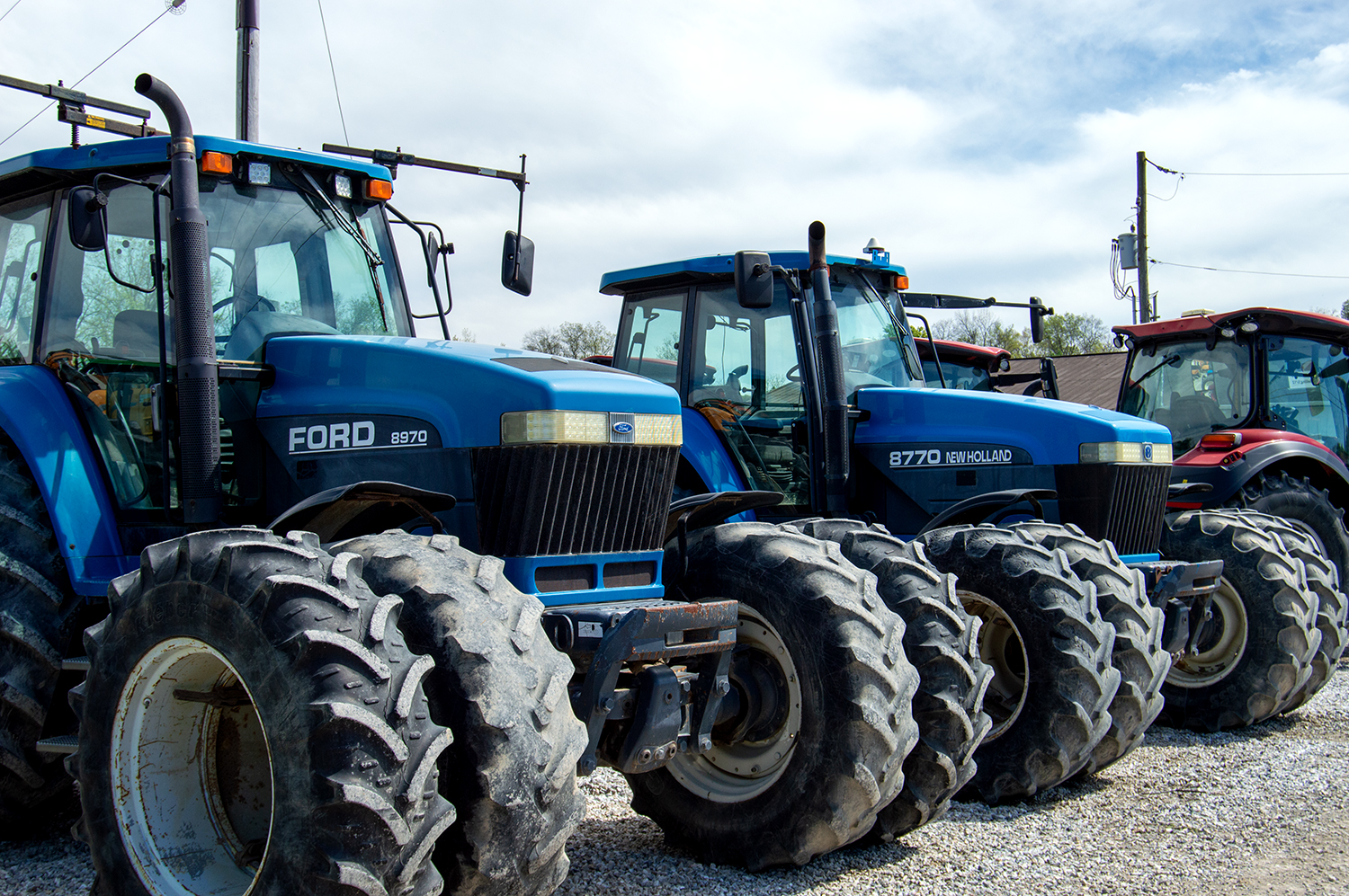 Used New Holland Tractors Lined Up on Auction Lot